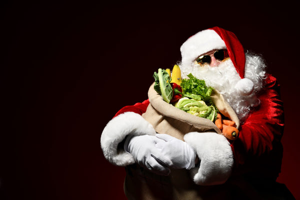 Santa Claus with a bag full of vegetables and fruits