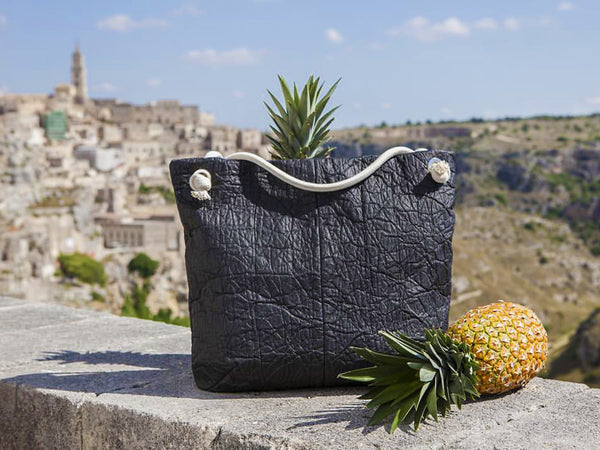 what is vegan leather landscape image of a vegan leather bag made from PALF pineapple leather